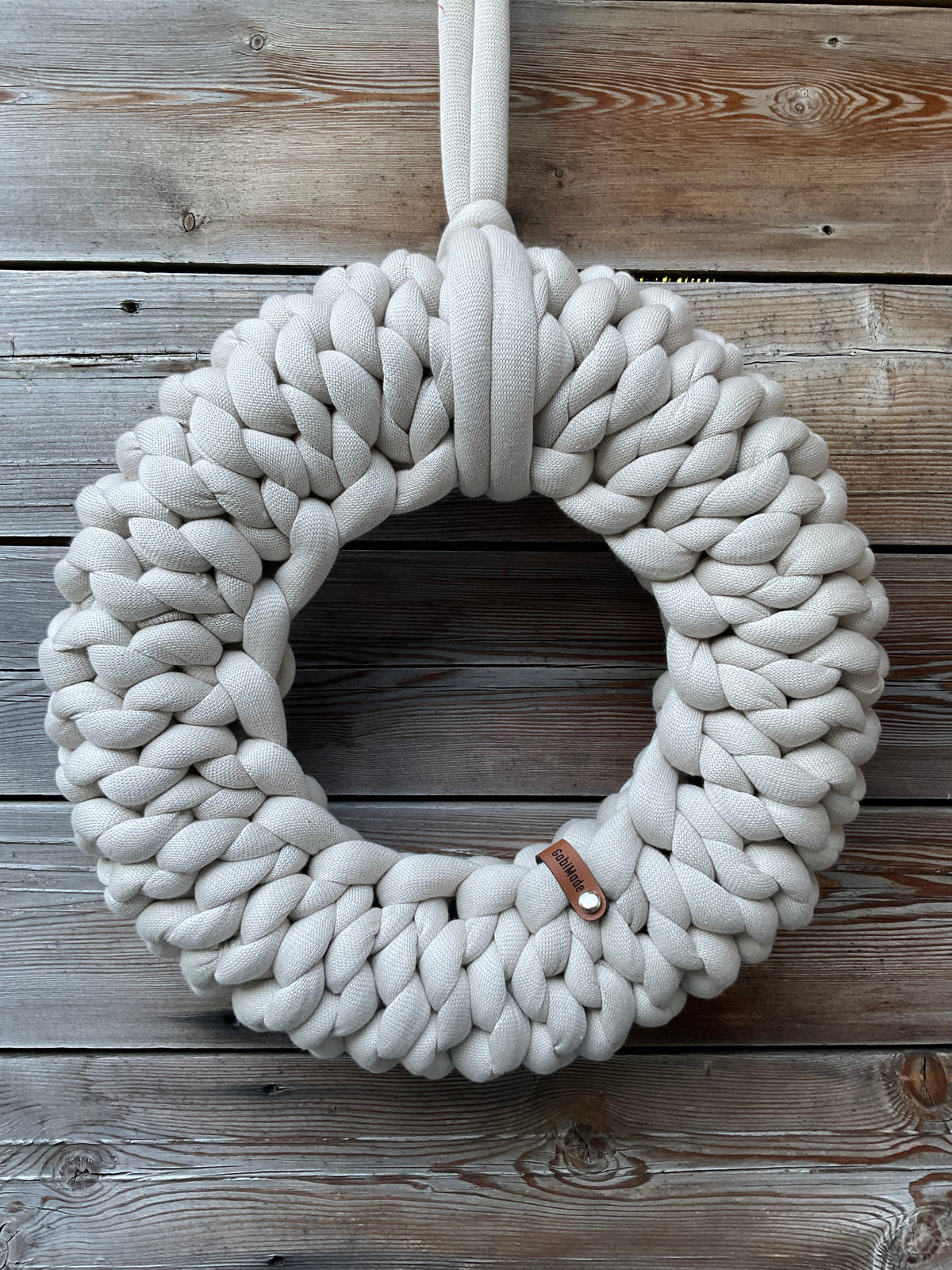 Ein gestrickter Kranz in Perl Gr. M